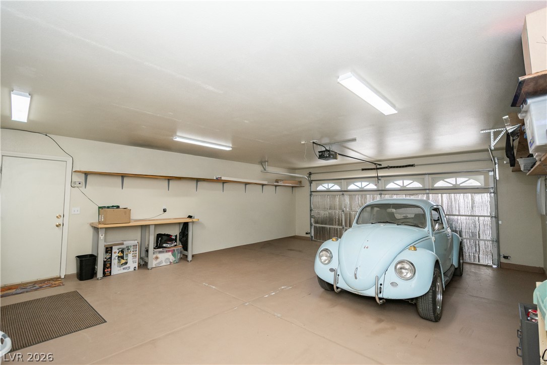 2381 Tough Boy Road Pahrump, NV 89060 - Photo 34 of 44 This spacious garage offers practical storage solutions and ample room for parking.