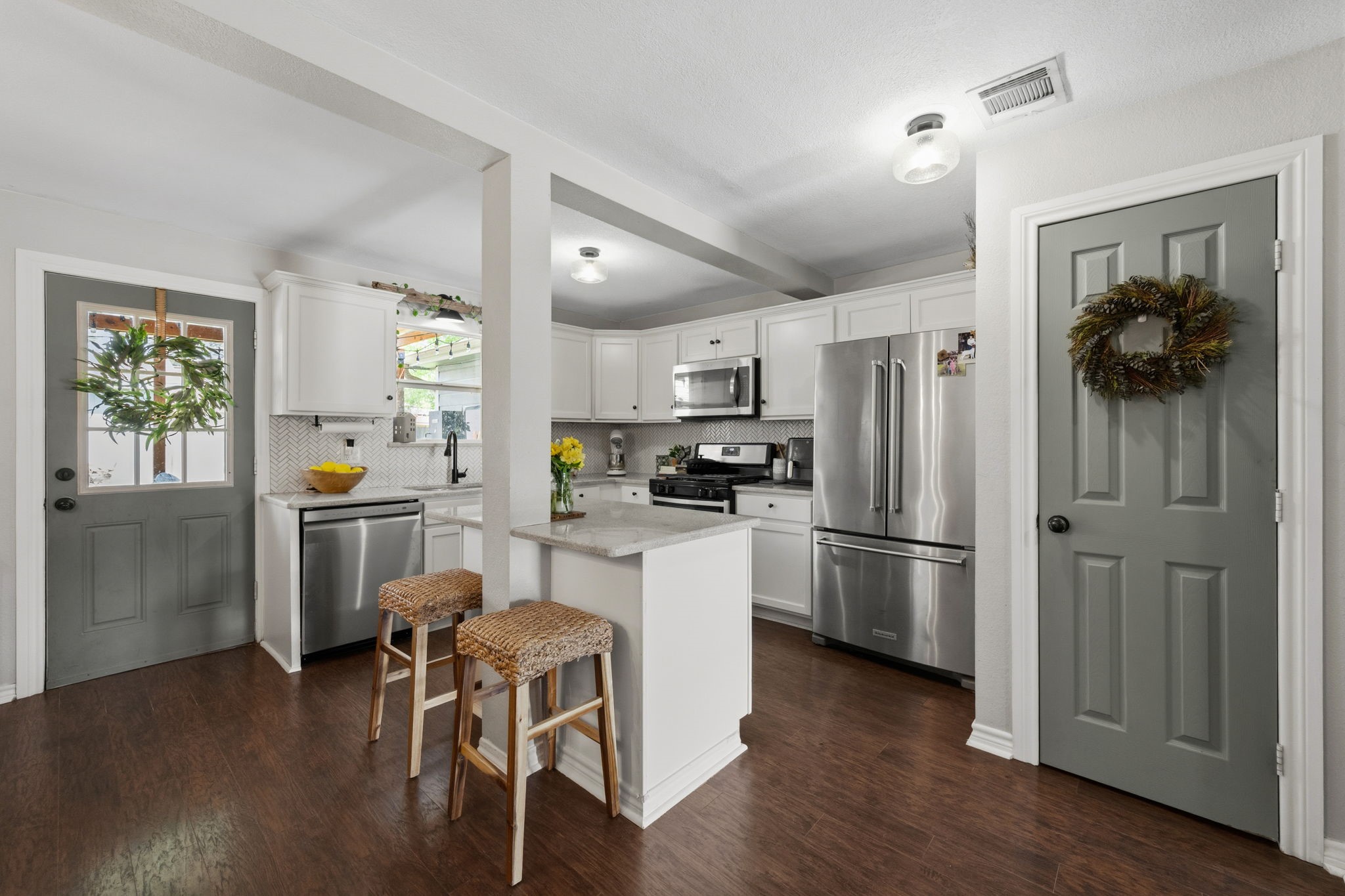 431 Corydon Drive Houston, TX 77336 - Photo 11 of 26 The kitchen features abundant cabinetry, generous workspace, and clear sightlines to the family and dining areas—ideal for staying connected while cooking or entertaining.