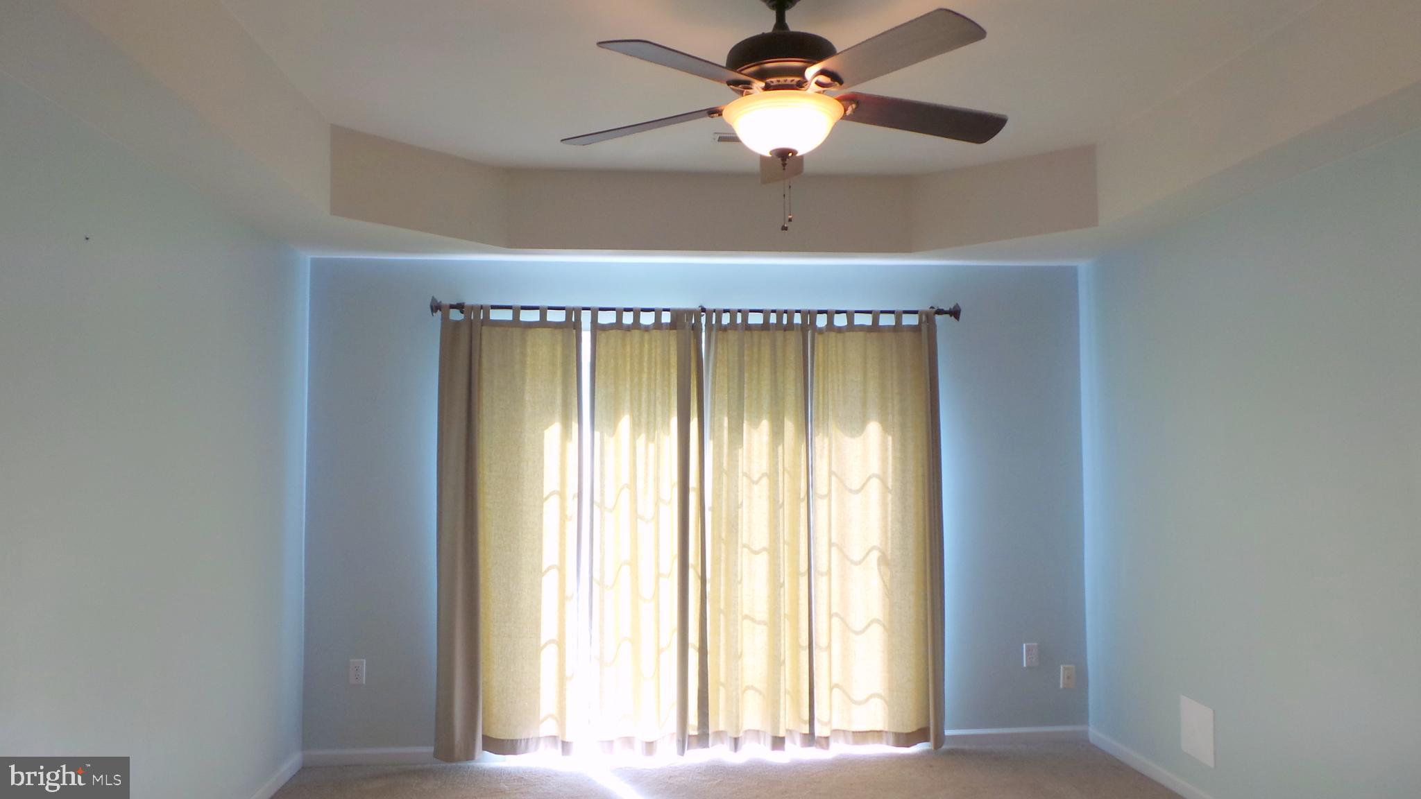 625 Ruxton Road, Unit 73 Solomons, MD 20629 - Photo 11 of 50 Master suite with Tray Ceiling Slider to back deck