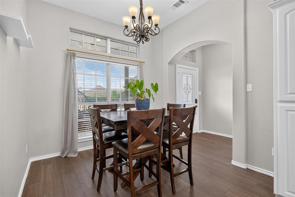 100 Radecke Road Krum, TX 76249 - Photo 16 of 29 Dining area featuring wood-finish flooring and light gray walls