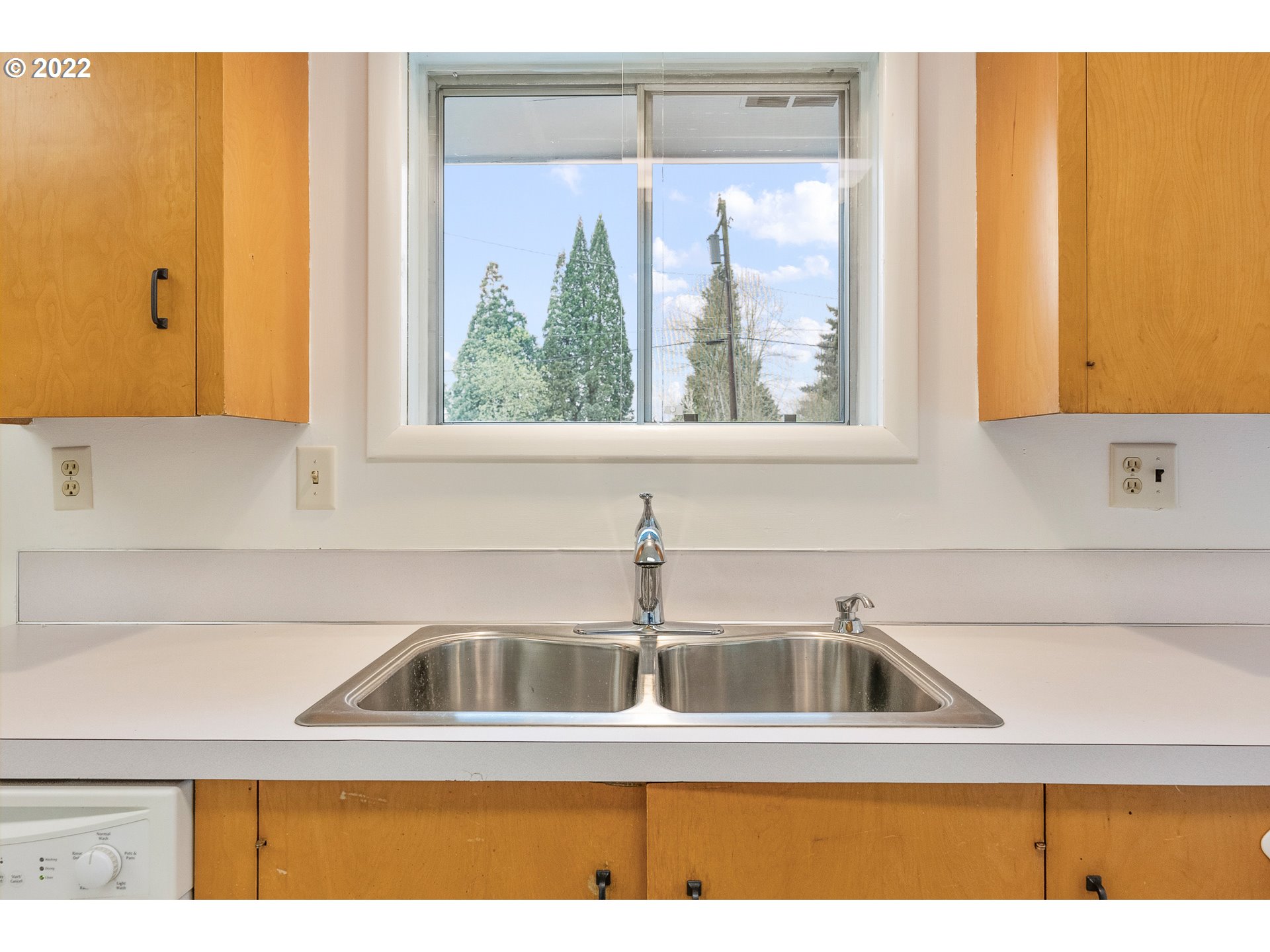 2900 Manor Drive Springfield, OR 97477 - Photo 13 of 32 a kitchen with a sink a window and cabinets