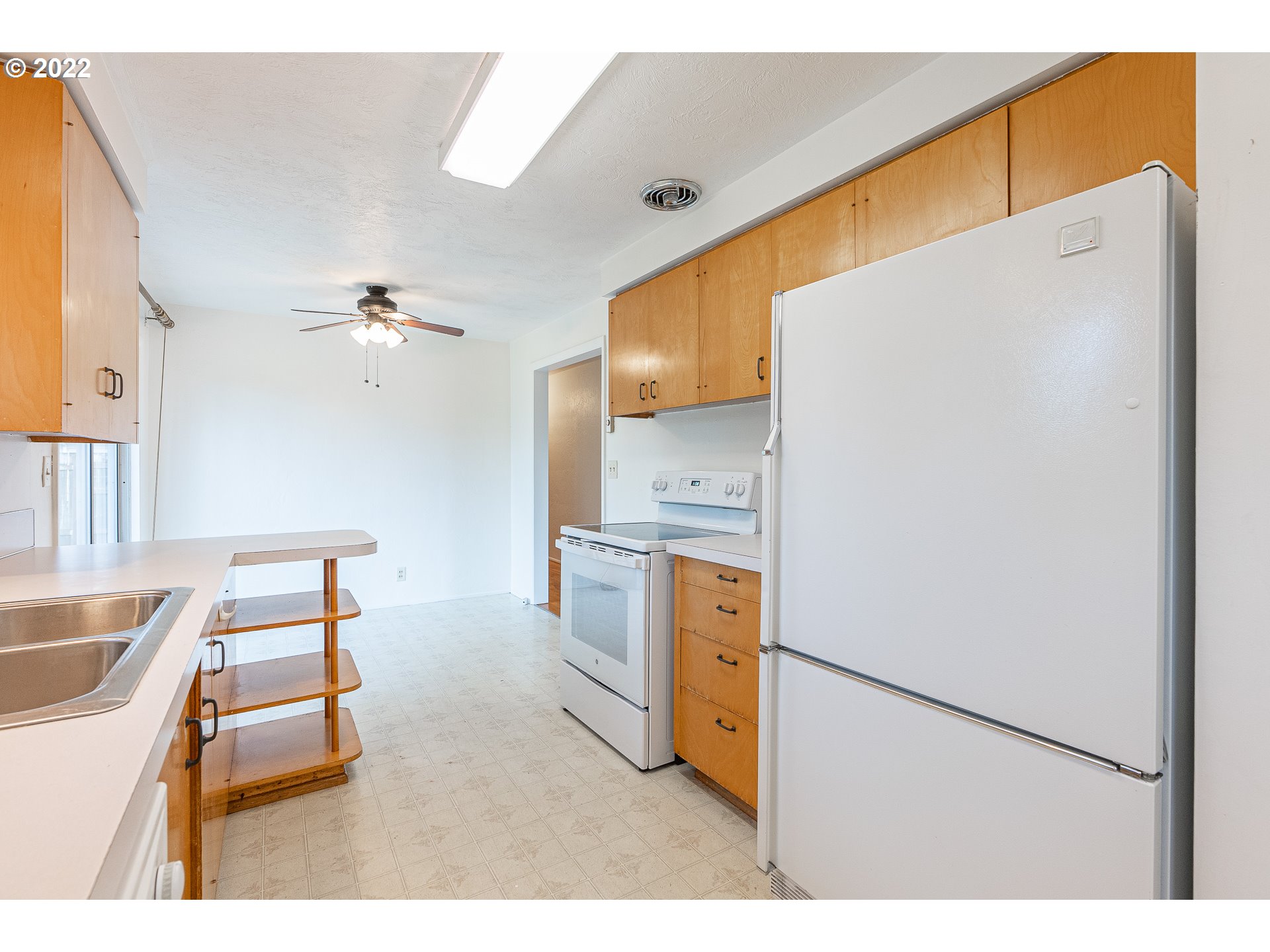 2900 Manor Drive Springfield, OR 97477 - Photo 14 of 32 a kitchen with a refrigerator and a sink