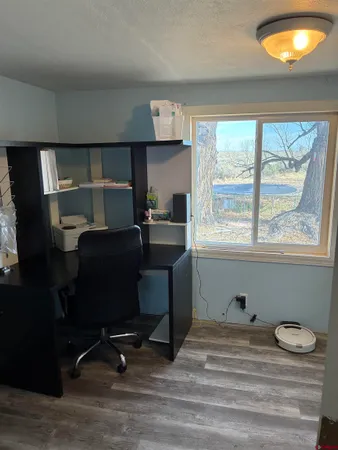 a room with a chair and a window