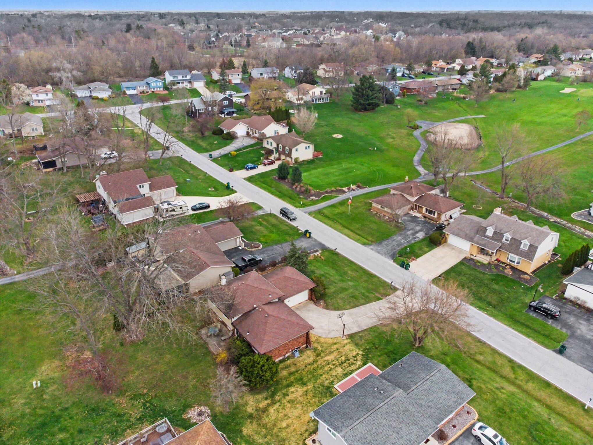 1379 Leeward Road Crown Point, IN 46307 - Photo 32 of 39 an aerial view of residential houses with outdoor space and parking