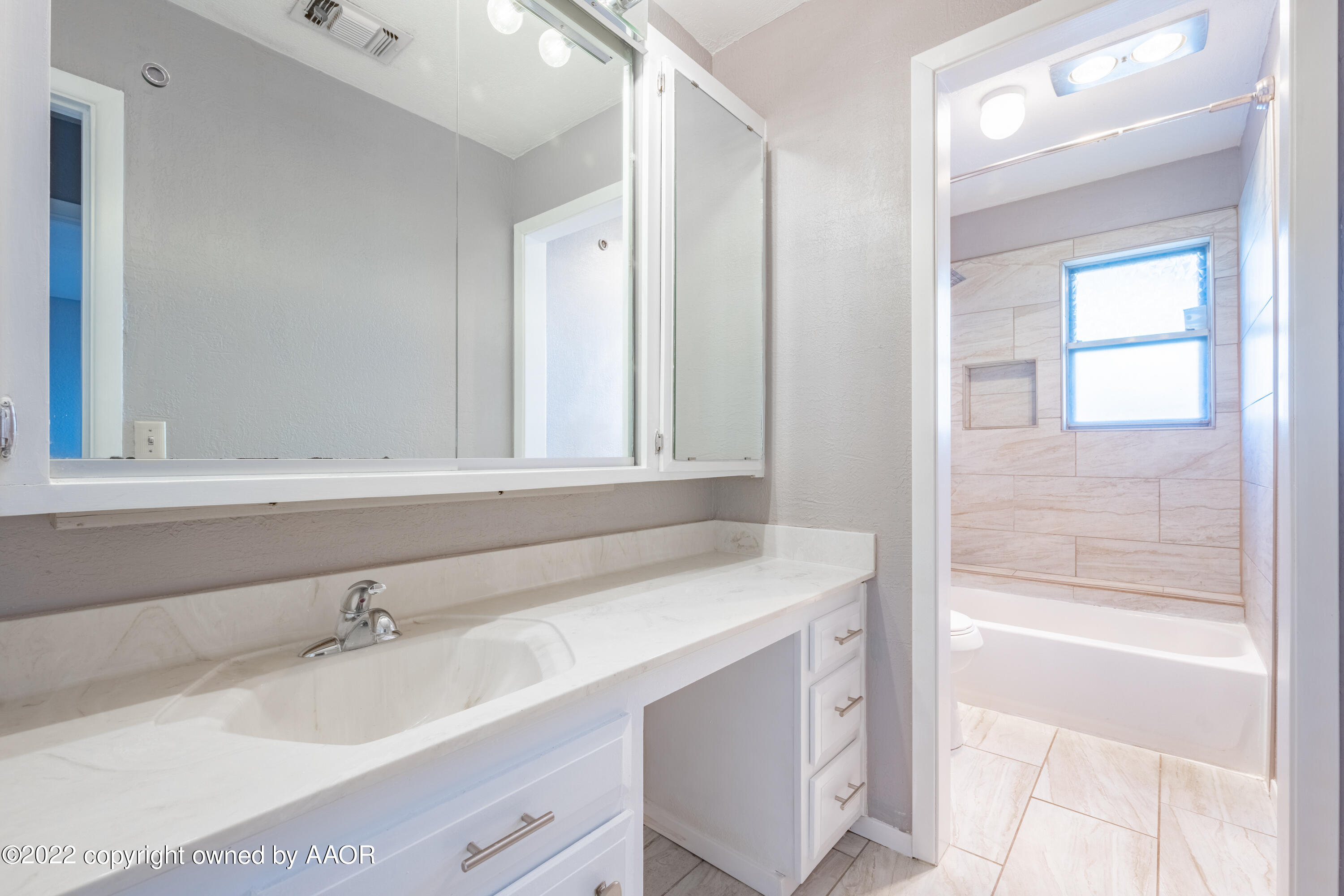 4610 South Georgia Street Amarillo, TX 79110 - Photo 18 of 25 a bathroom with a sink and a bathtub