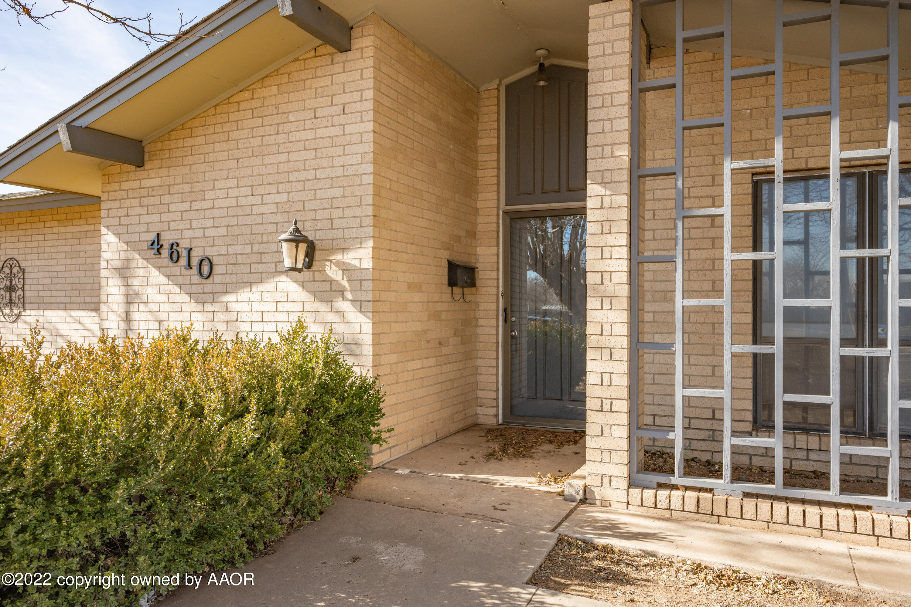 4610 South Georgia Street Amarillo, TX 79110 - Photo 2 of 25 a view of a door and a window