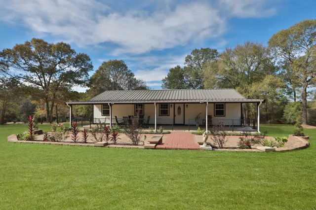 a front view of house with yard and seating area