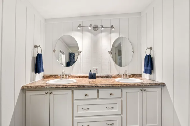 a view of washer and dryer with kitchen in the background