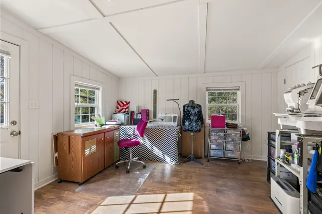 a bathroom with a granite countertop bathtub sink vanity and mirror