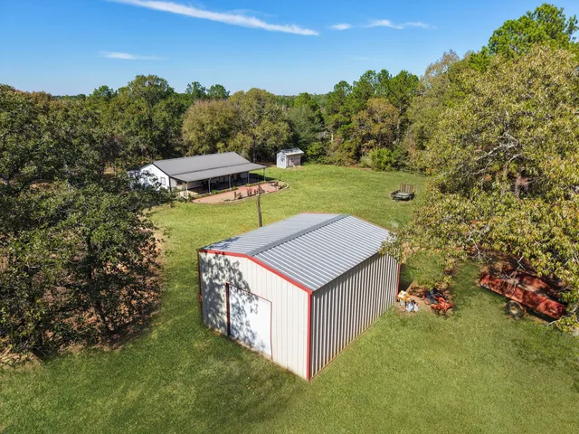 a view of a yard with a tree