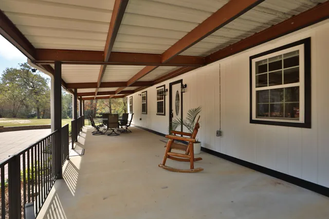 a view of porch with a door and a window