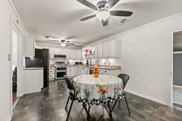 a kitchen with cabinets a sink and stainless steel appliances