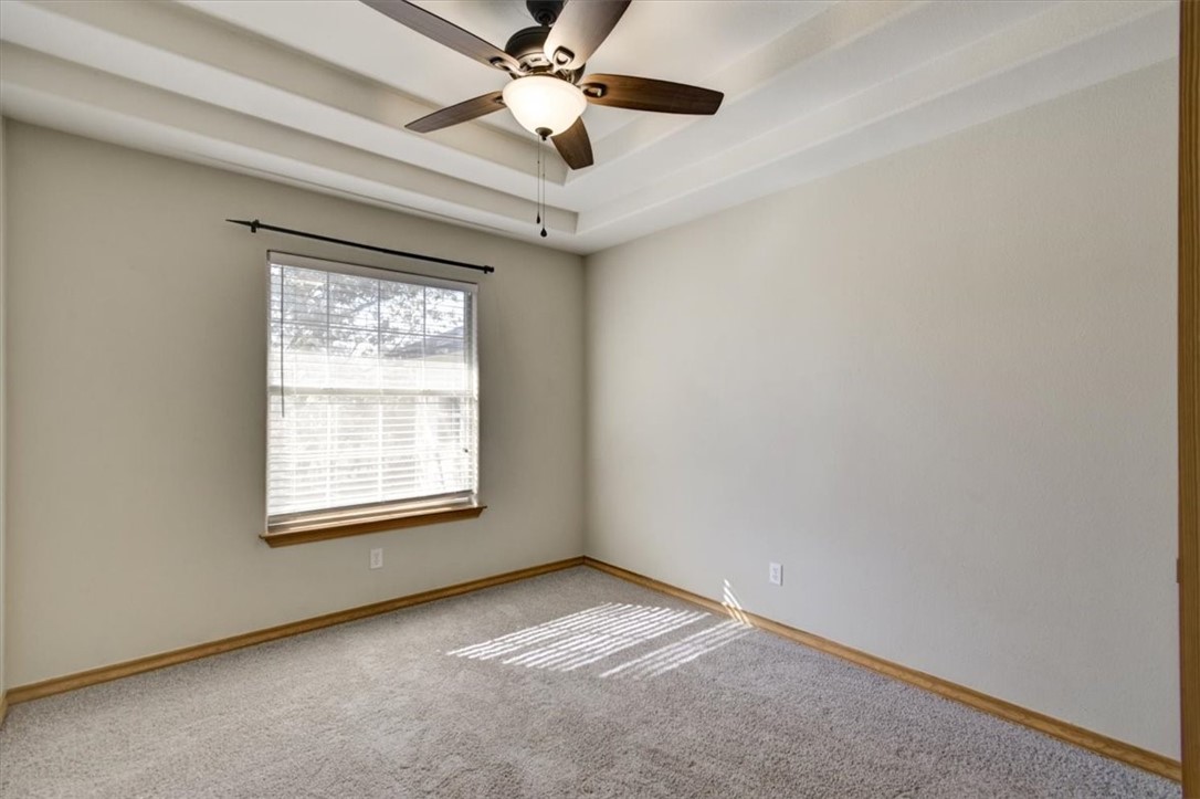 21415 Boggy Ford Road Lago Vista, TX 78645 - Photo 24 of 40 an empty room with a window and a fan