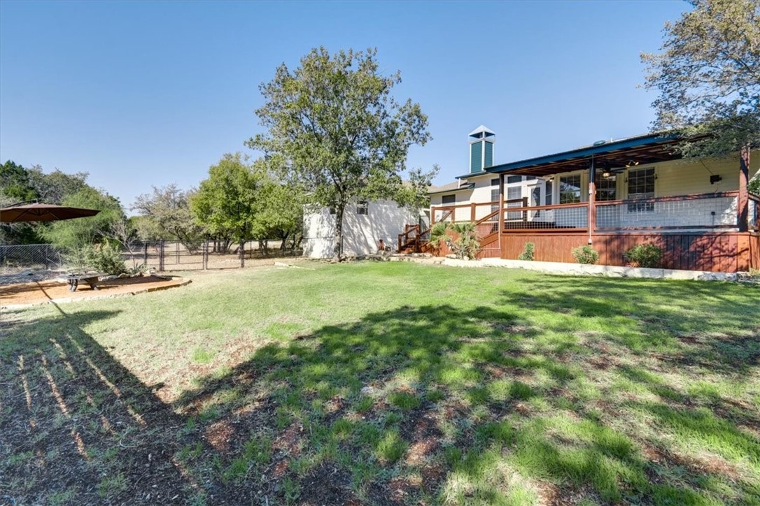 21415 Boggy Ford Road Lago Vista, TX 78645 - Photo 31 of 40 a view of a house with a big yard and large trees