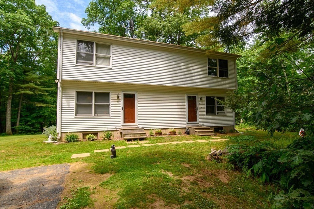 394 Bemis Road Warren, MA 01585 - Photo 1 of 35 a front view of a house with yard and green space