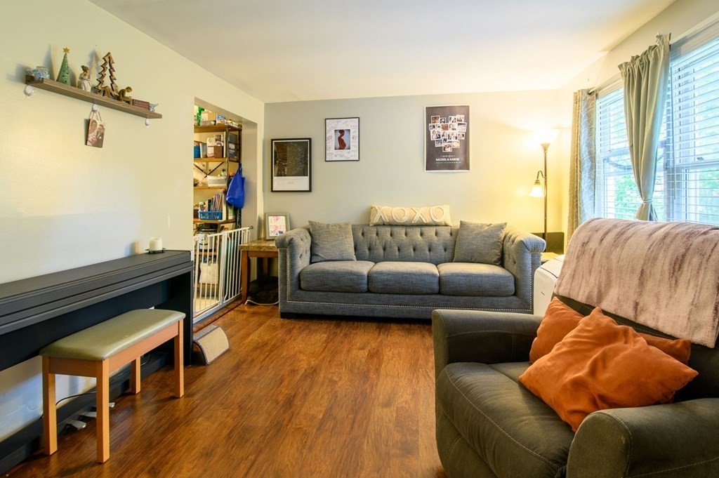 394 Bemis Road Warren, MA 01585 - Photo 11 of 35 a living room with furniture and a wooden floor