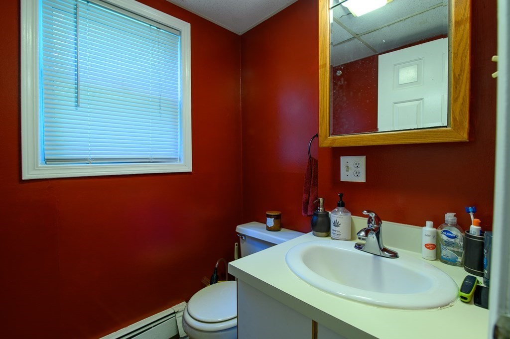 394 Bemis Road Warren, MA 01585 - Photo 26 of 35 a bathroom with a sink a toilet and mirror