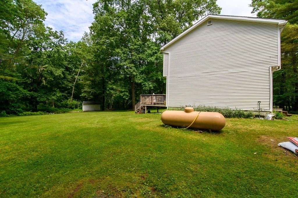 394 Bemis Road Warren, MA 01585 - Photo 28 of 35 a view of backyard with a garden and entertaining space