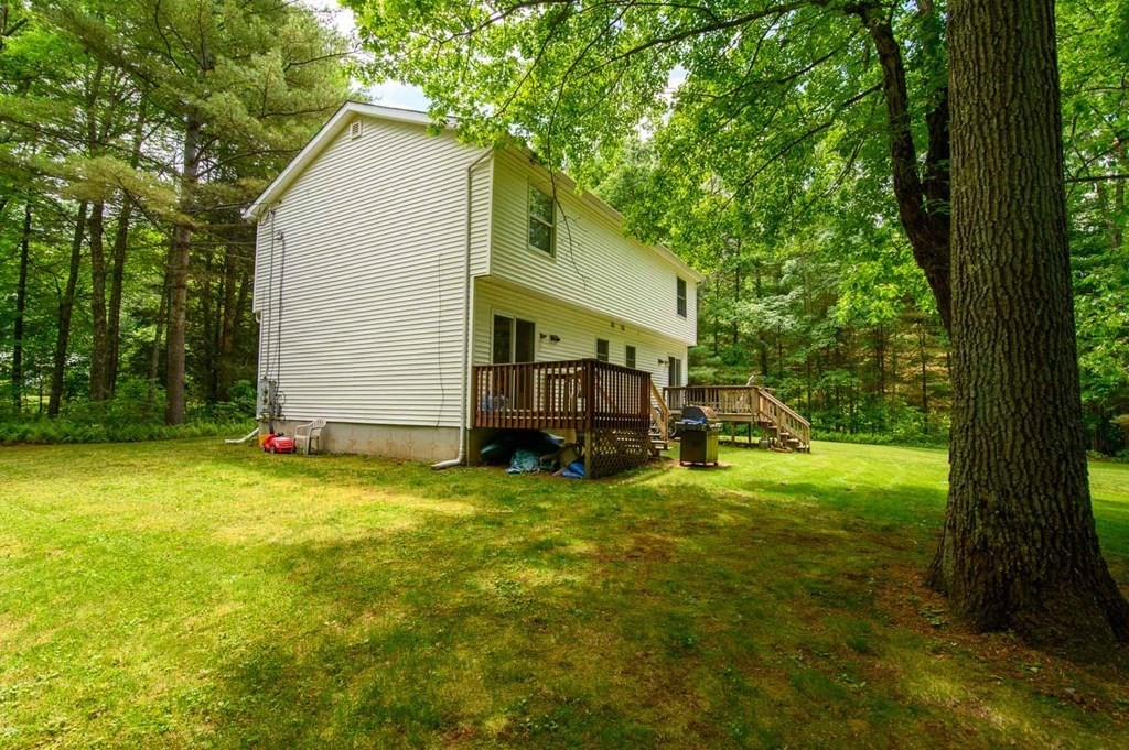 394 Bemis Road Warren, MA 01585 - Photo 5 of 35 a view of a house with backyard