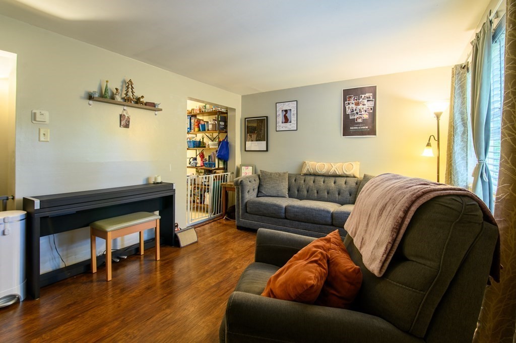 394 Bemis Road Warren, MA 01585 - Photo 9 of 35 a living room with furniture and a wooden floor