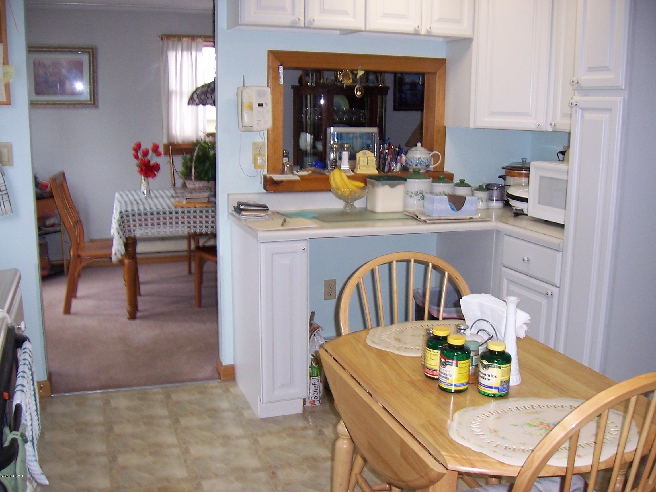 41 Como Road Lakewood, PA 18439 - Photo 5 of 22 KITCHEN INTO DINING AREA