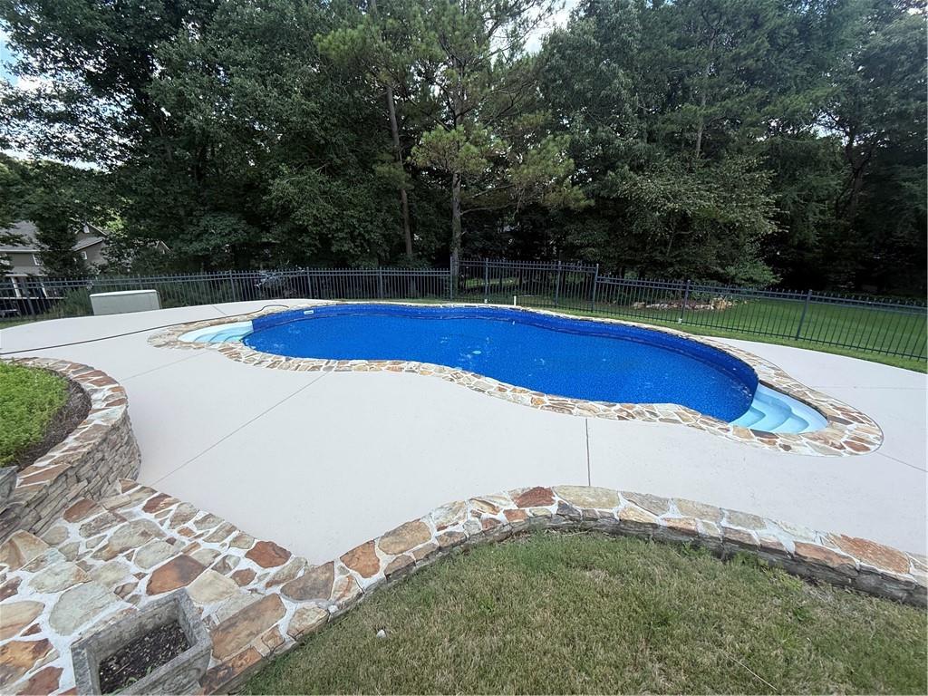 113 Warwick Way Rome, GA 30161 - Photo 49 of 49 a view of a swimming pool with an outdoor space and seating area