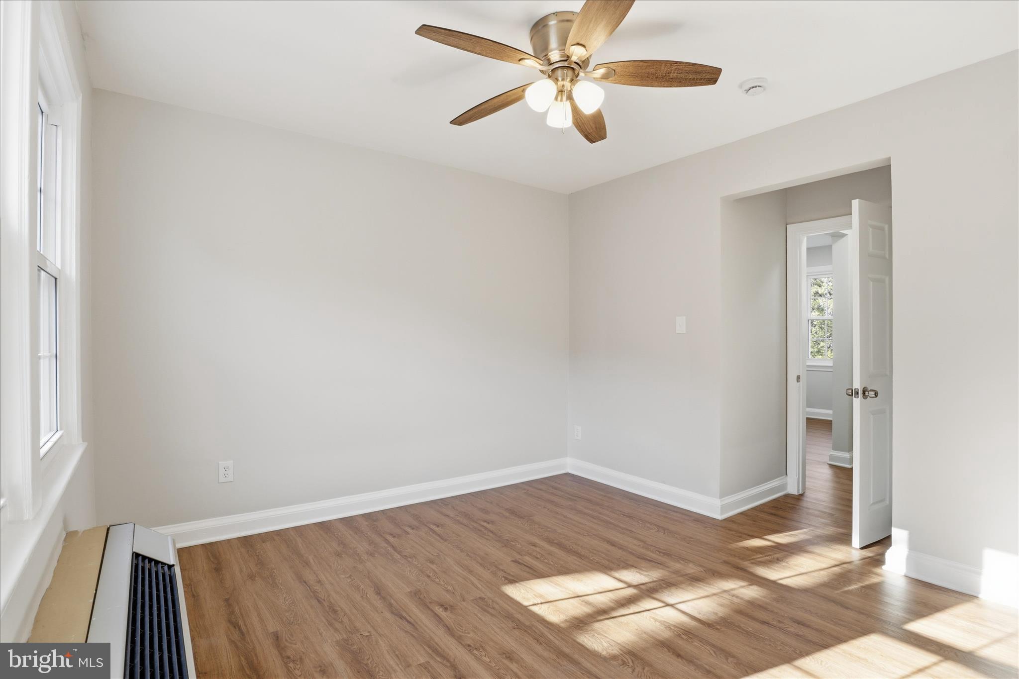 1804 West Abingdon Drive, Unit 201 Alexandria, VA 22314 - Photo 14 of 24 a view of empty room with wooden floor