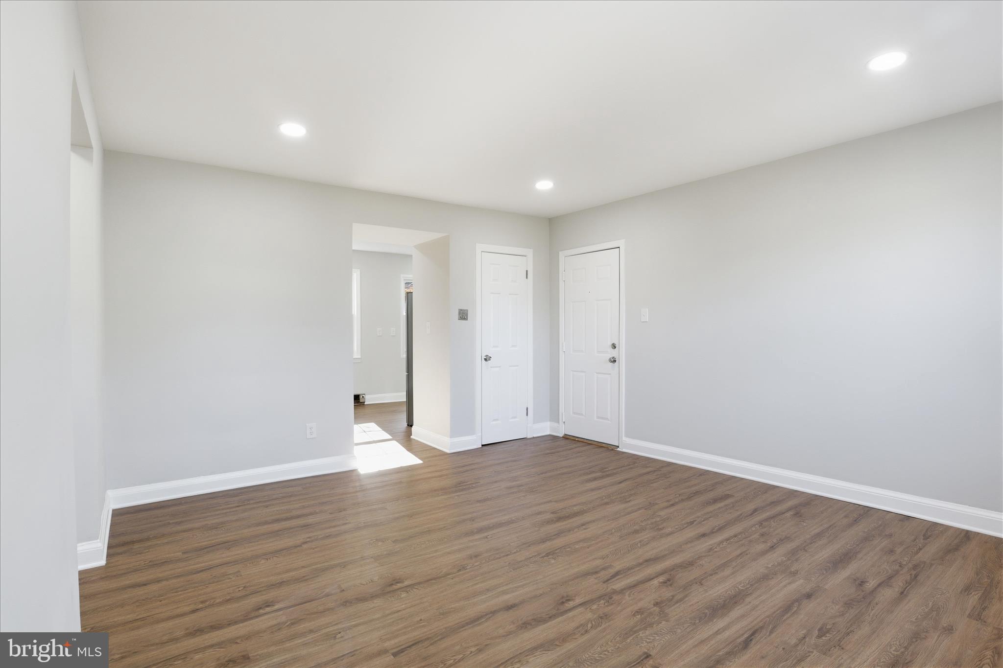 1804 West Abingdon Drive, Unit 201 Alexandria, VA 22314 - Photo 6 of 24 a view of an empty room with wooden floor