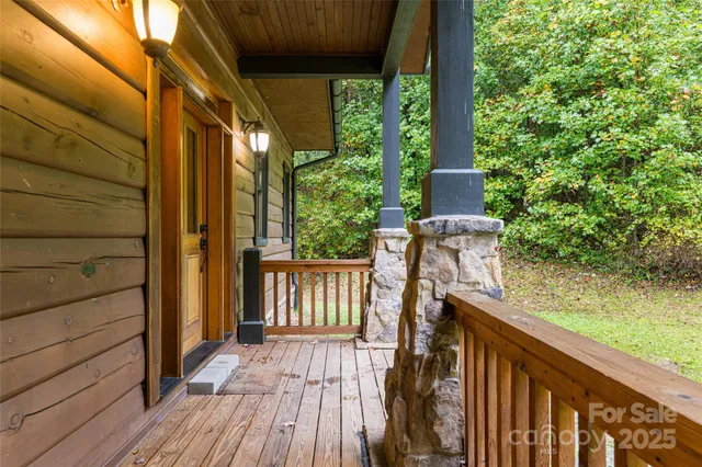 a view of balcony with wooden floor and fence