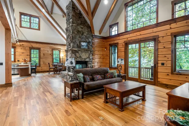 a living room with furniture fireplace and wooden floor
