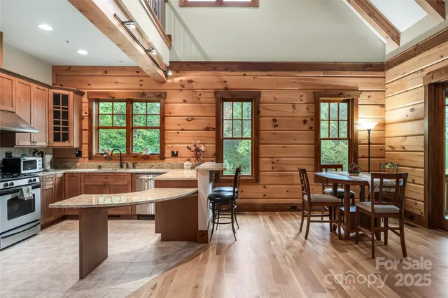 a view of a dining room with furniture window and outside view