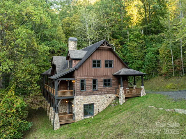 a view of a house with a yard porch and sitting area