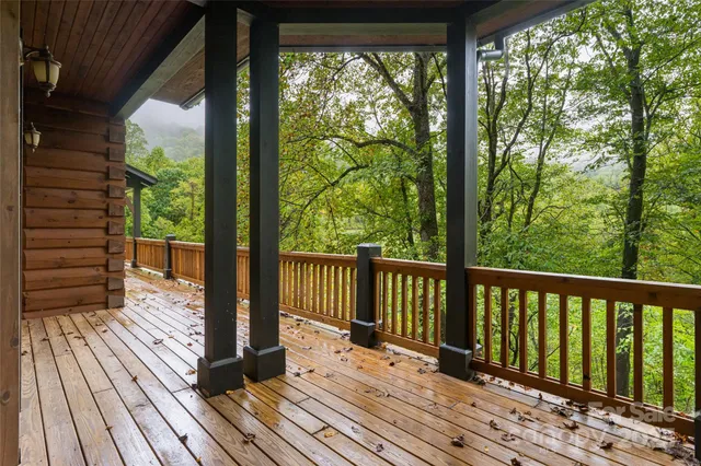 a view of balcony with wooden floor