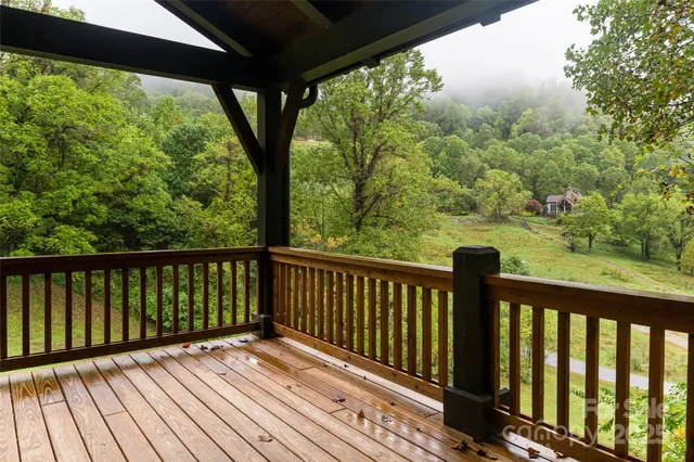 a view of balcony with wooden floor