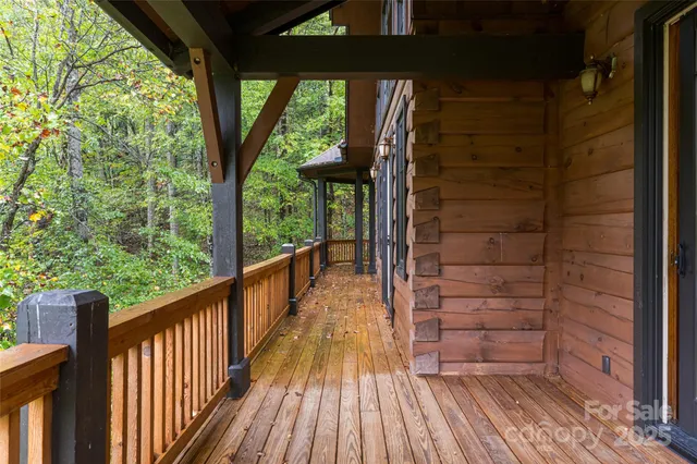 a view of a balcony with wooden floor
