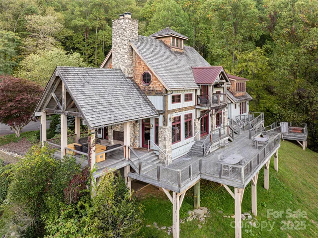 a aerial view of a house with a yard