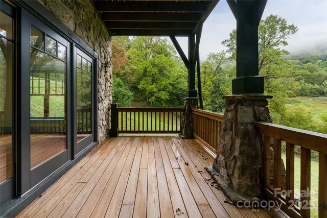a view of a balcony with wooden floor