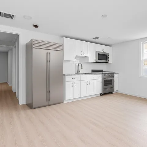 a view of a kitchen with a sink