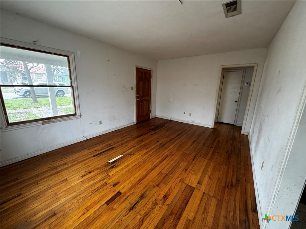 1010 South 17th Street Temple, TX 76504 - Photo 6 of 30 a view of a room with wooden floor and a window