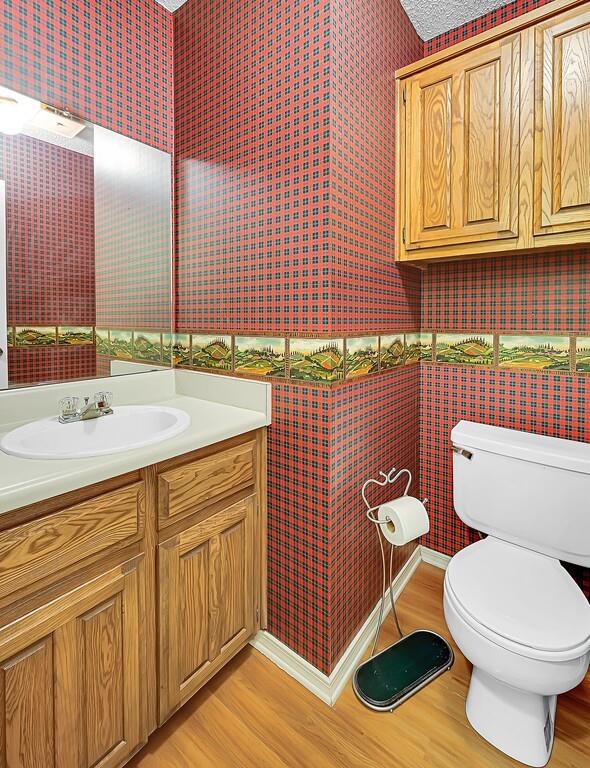 112 Pleasant Grove Lane Waco, TX 76712 - Photo 16 of 34 a bathroom with a sink a toilet and mirror