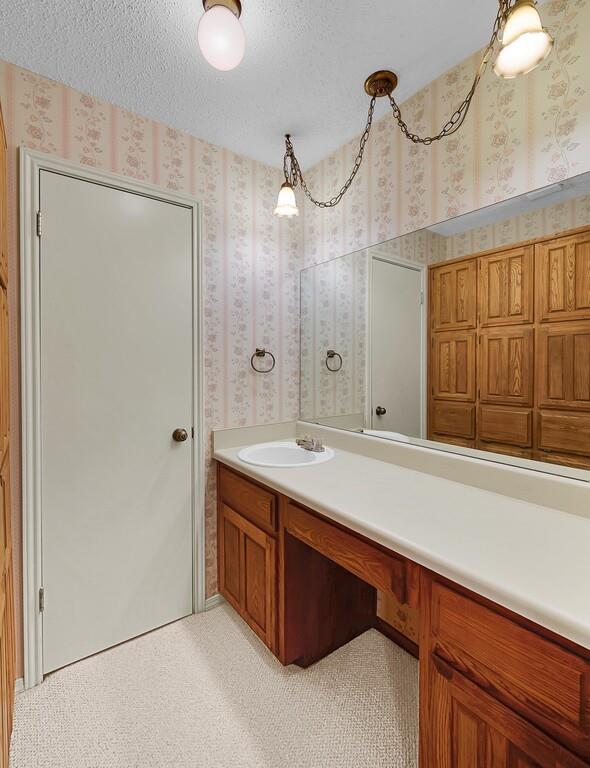 112 Pleasant Grove Lane Waco, TX 76712 - Photo 26 of 34 a bathroom with a double vanity sink and a mirror