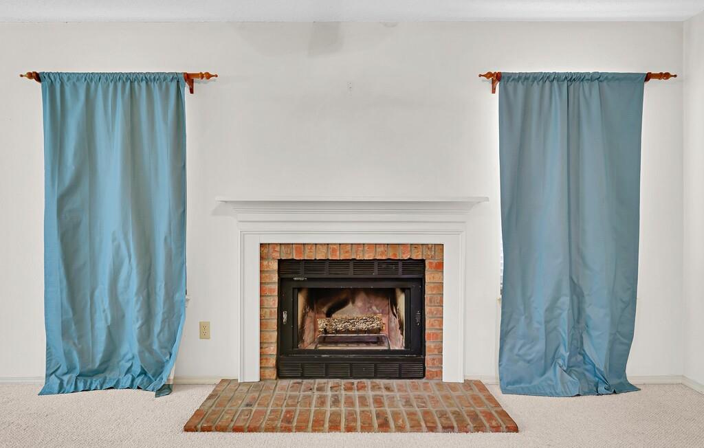 112 Pleasant Grove Lane Waco, TX 76712 - Photo 8 of 34 a living room with a fireplace and a rug