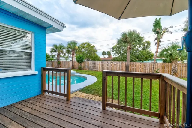 a view of a balcony with wooden floor
