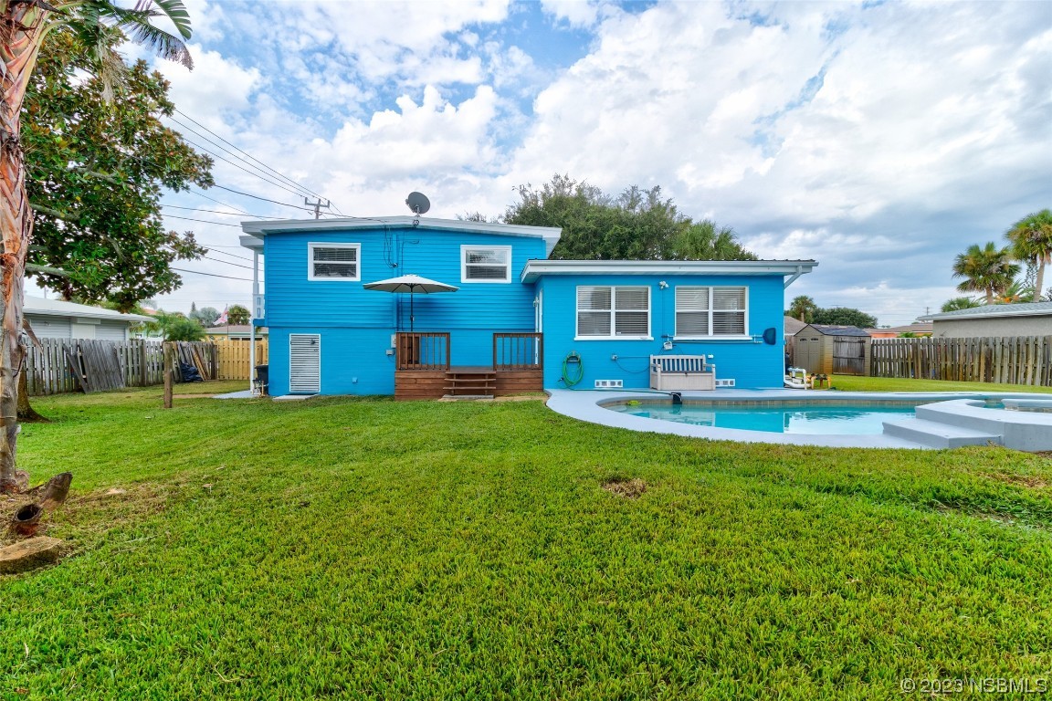 923 Peninsula Drive Ormond Beach, FL 32176 - Photo 28 of 33 a front view of house with yard and outdoor seating