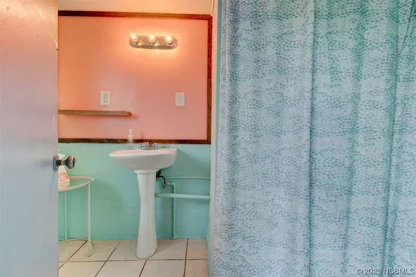 a bathroom with a sink and mirror