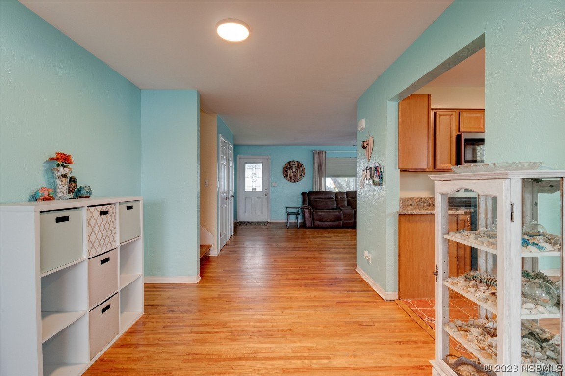 923 Peninsula Drive Ormond Beach, FL 32176 - Photo 7 of 33 a living room with furniture and wooden floor