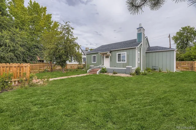 a front view of house with yard and seating area