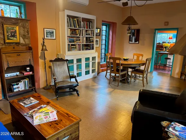 a living room filled with furniture and a flat screen tv