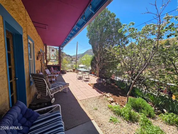 a view of a backyard with sitting area