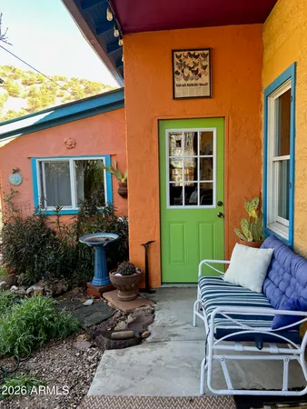 a view of a patio with a table and chairs in patio